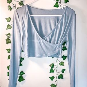light blue wrap longsleeve shirt. (cropped)